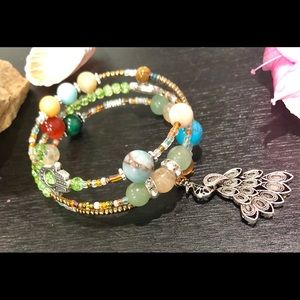 Beaded wrap bracelet W/ peacock accent